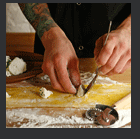 Hands making raviolis, large version opens in new window